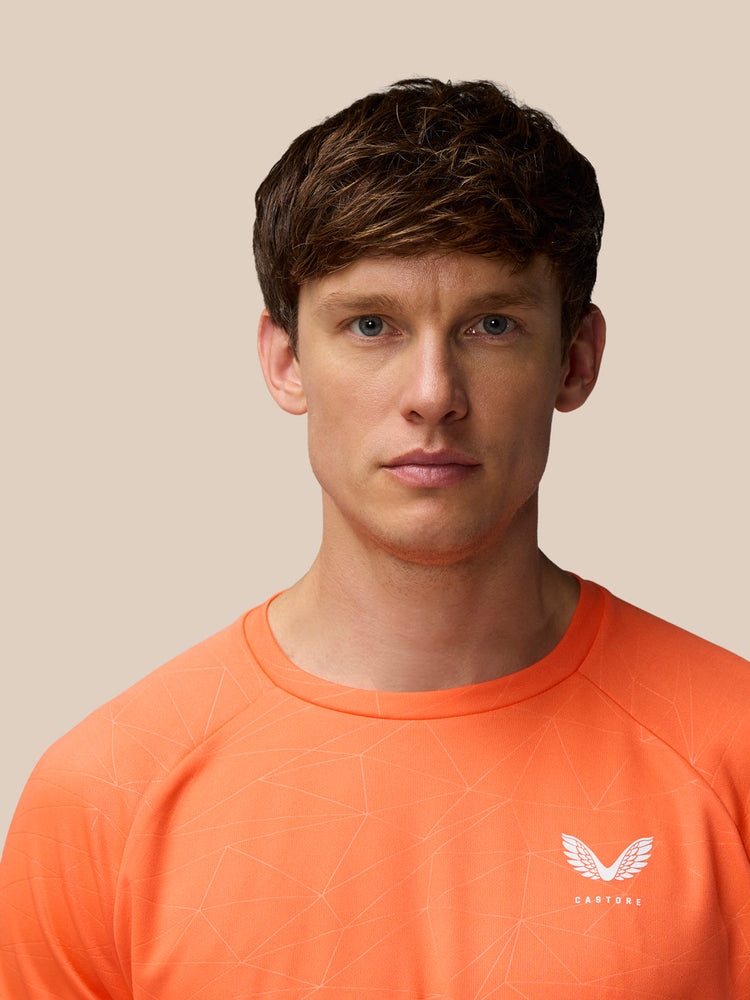 Herren-T-Shirt mit Allover-Print und kurzen Ärmeln – Orange