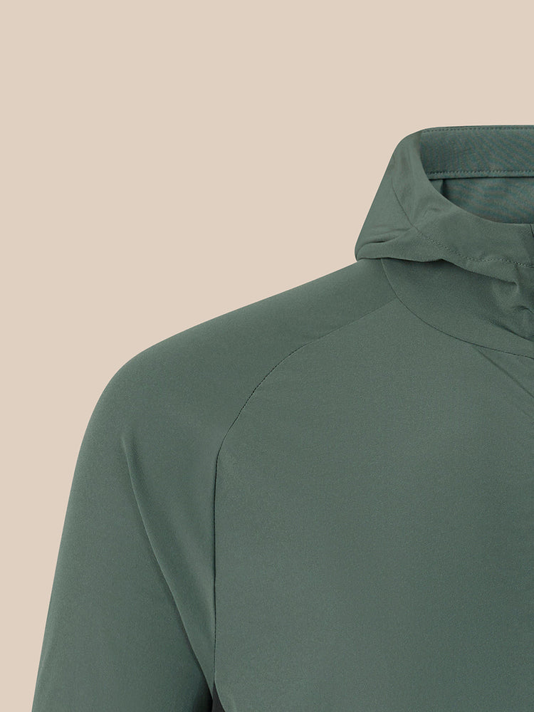 Dark green jacket on a beige background