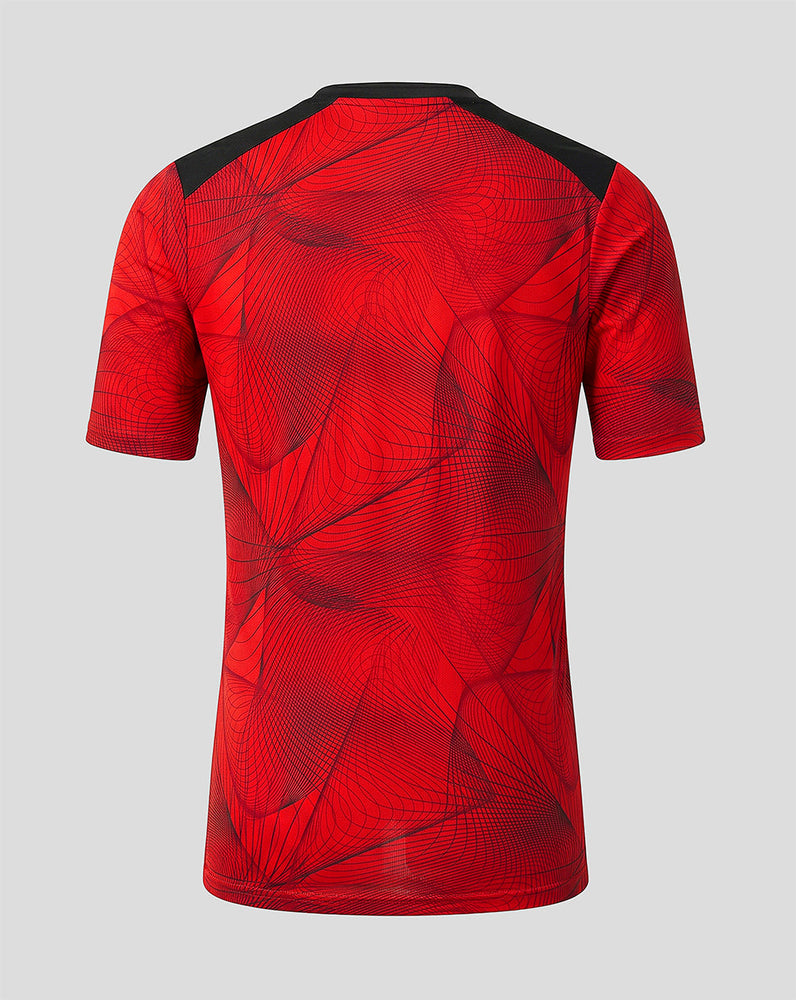 Back view of Feyenoord junior home shirt 2026-27 featuring red abstract pattern and black shoulder panels
