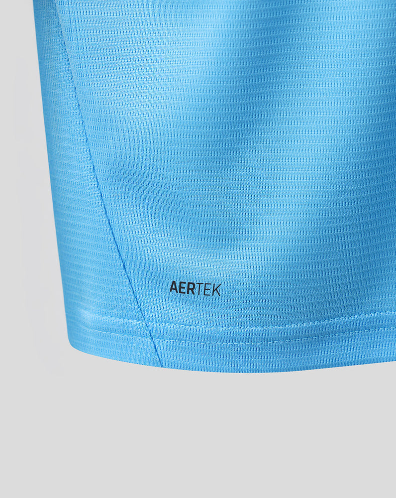 Close up of blue Feyenoord training shirt fabric with AERTEK label at the hem