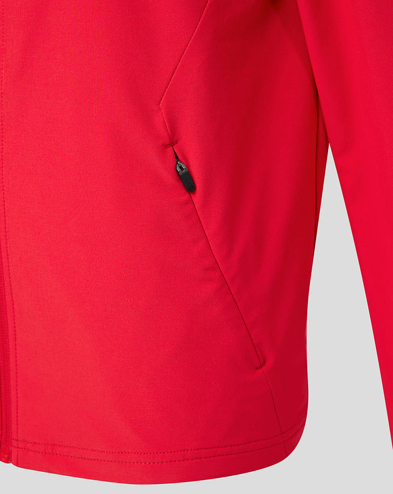 Close-up of red FC Utrecht Junior jacket pocket with zipper.