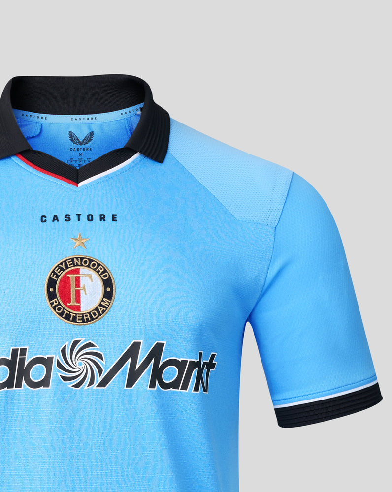 Close-up of the blue Feyenoord jersey collar and shoulder with a black collar and Castore branding.
